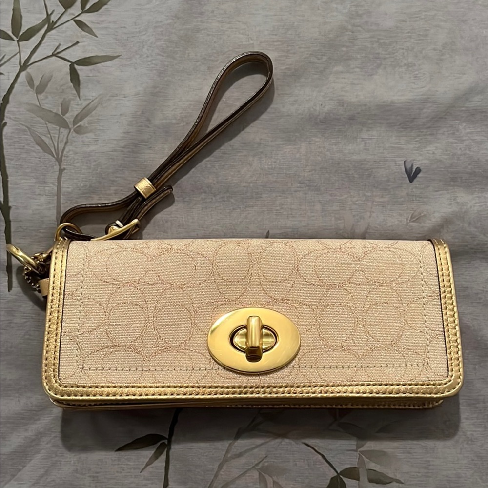 Elegant Coach Cream and Gold Women's Wristlet